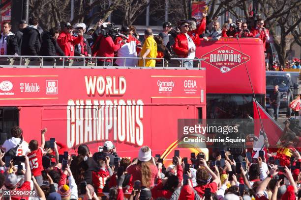 Patrick Mahomes of the Kansas City Chiefs throws a football during the Kansas City Chiefs Super Bowl LVIII victory parade on February 14, 2024 in...