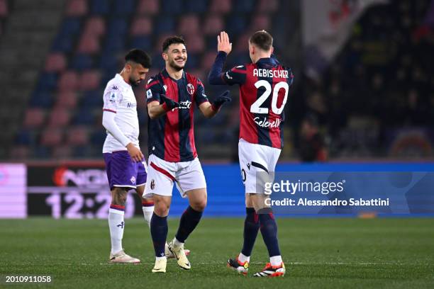 Riccardo Orsolini of Bologna FC celebrates scoring his team's first goal with teammate Michel Aebischer during the Serie A TIM match between Bologna...