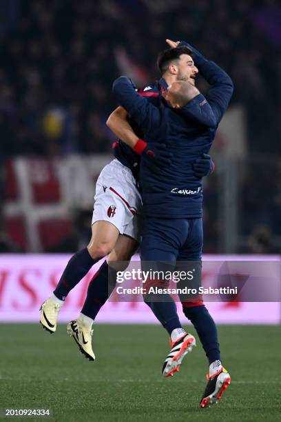 Riccardo Orsolini of Bologna FC celebrates scoring his team's first goal with teammate Lorenzo De Silvestri during the Serie A TIM match between...