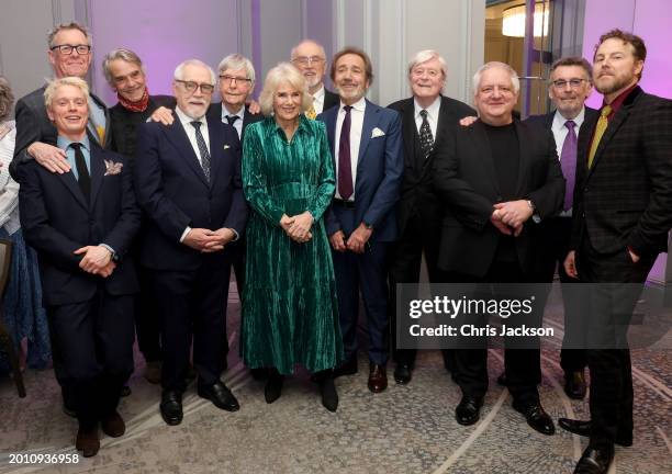 Queen Camilla smiles as she poses with Alex Jennings, Freddie Fox, Jeremy Irons, Brian Cox, Tom Courtenay, Peter Egan, Robert Lindsay, Martin Jarvis,...