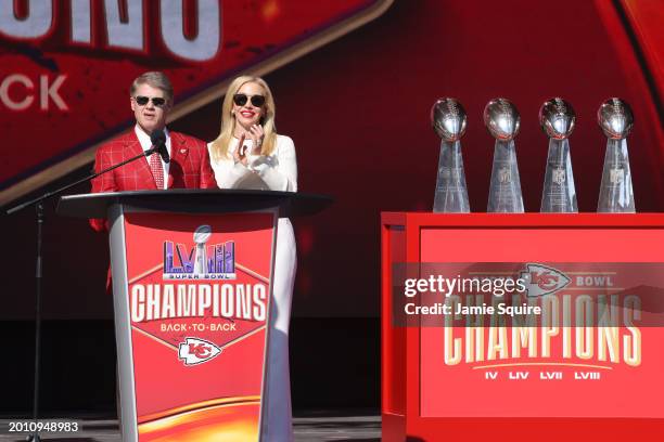 Kansas City Chiefs owner Clark Hunt and wife Tavia Shackles address fans during the Kansas City Chiefs Super Bowl LVIII victory parade on February...