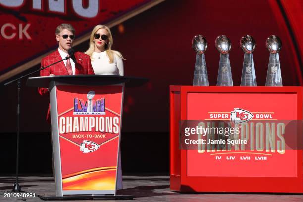 Kansas City Chiefs owner Clark Hunt and wife Tavia Shackles address fans during the Kansas City Chiefs Super Bowl LVIII victory parade on February...