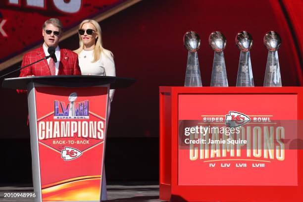 Kansas City Chiefs owner Clark Hunt and wife Tavia Shackles address fans during the Kansas City Chiefs Super Bowl LVIII victory parade on February...