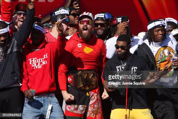 Travis Kelce of the Kansas City Chiefs celebrates on stage with teammates during the Kansas City Chiefs Super Bowl LVIII victory parade on February...