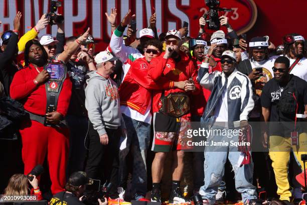Patrick Mahomes and Travis Kelce of the Kansas City Chiefs celebrate on stage with teammates during the Kansas City Chiefs Super Bowl LVIII victory...