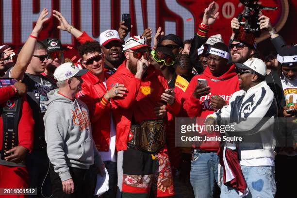 Travis Kelce of the Kansas City Chiefs addresses the fans on stage during the Kansas City Chiefs Super Bowl LVIII victory parade on February 14, 2024...
