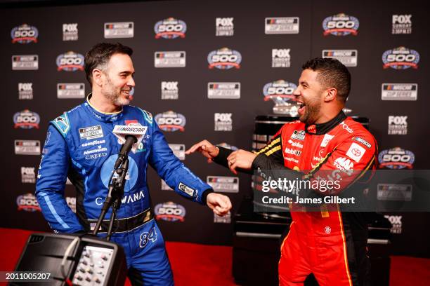 Jimmie Johnson talks with Bubba Wallace during the NASCAR Cup Series 66th Annual Daytona 500 Media Day at Daytona International Speedway on February...