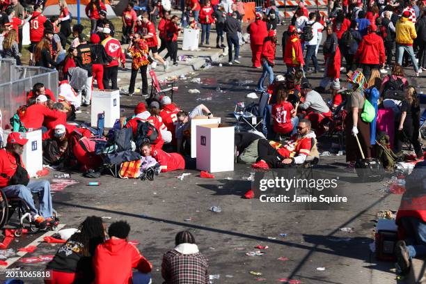 People take cover during a shooting at Union Station during the Kansas City Chiefs Super Bowl LVIII victory parade on February 14, 2024 in Kansas...