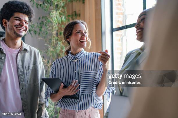 diverse team engaging in creative brainstorming in modern office - roupa descontraída imagens e fotografias de stock