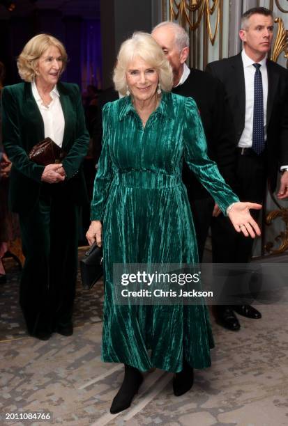 Queen Camilla smiles and gestures as she attends the "Celebration Of Shakespeare" with her sister Annabel Elliot at Grosvenor House on February 14,...