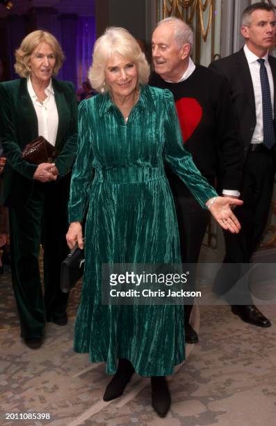 Queen Camilla smiles and gestures as she attends the "Celebration Of Shakespeare" with her sister Annabel Elliot and host Gyles Brandreth at...