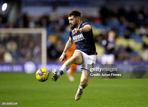 Tom Bradshaw of Millwall controls the ball during the Sky Bet Championship match between Millwall and Ipswich Town at The Den on February 14, 2024 in...