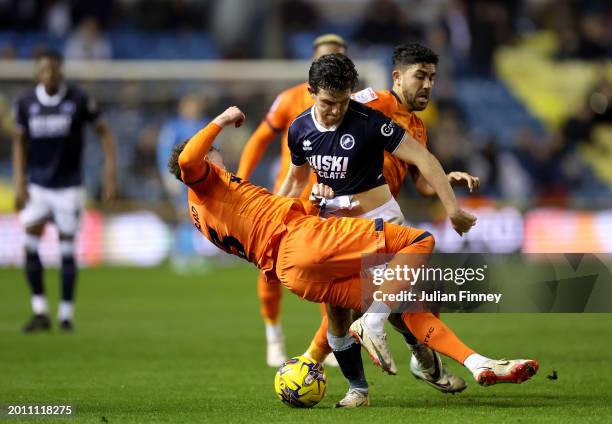 Nathan Broadhead of Ipswich Town is challenged by George Honeyman of Millwall during the Sky Bet Championship match between Millwall and Ipswich Town...