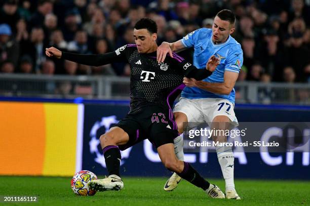 Adam Marusic of SS Lazio competes for the ball with Noussair Musiala of Bayern Munchen during a press conference ahead of their UEFA Champions League...