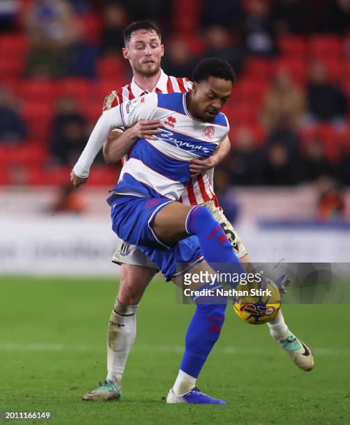 Jordan Thompson of Stoke City and Chris Willock of Queens Park Rangers compete for the ball during the Sky Bet Championship match between Stoke City...