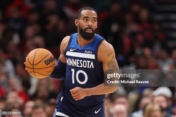 Mike Conley of the Minnesota Timberwolves dribbles up the court against the Chicago Bulls during the first half at the United Center on February 06,...