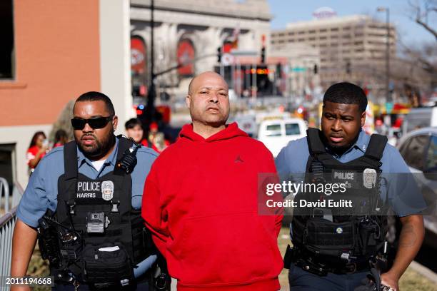 Man is detained by law enforcement following a shooting at Union Station during the Kansas City Chiefs Super Bowl LVIII victory parade on February...