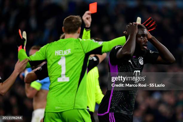 The referee Francois Letexier show a ref cardo to Dayot Upamecano of Bayern Munchen during the UEFA Champions League 2023/24 round of 16 first leg...