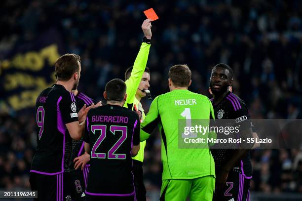 The referee Francois Letexier show a ref cardo to Dayot Upamecano of Bayern Munchen during the UEFA Champions League 2023/24 round of 16 first leg...