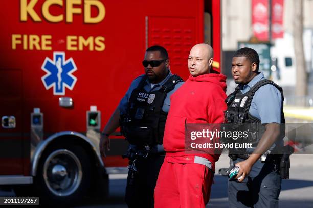 Man is detained by law enforcement following a shooting at Union Station during the Kansas City Chiefs Super Bowl LVIII victory parade on February...