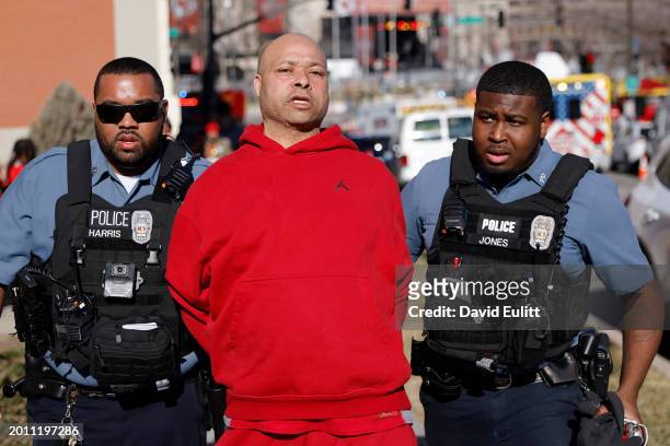 Man is detained by law enforcement following a shooting at Union Station during the Kansas City Chiefs Super Bowl LVIII victory parade on February...
