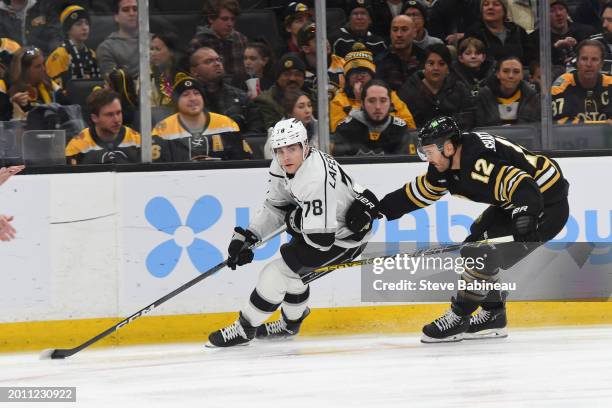 Alex Laferriere of the Los Angeles Kings skates against Kevin Shattenkirk of the Boston Bruins at the TD Garden on February 17, 2024 in Boston,...