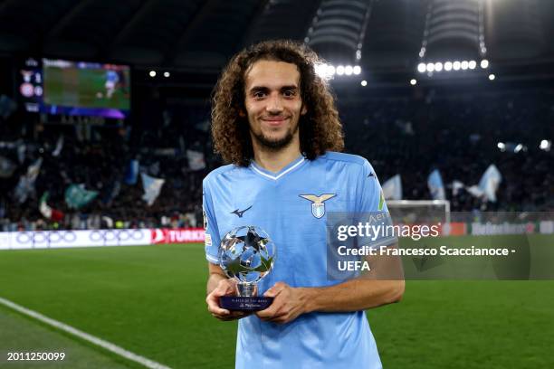 Matteo Guendouzi of SS Lazio poses for a photo after being awarded the PlayStation Player of the Match at full-time following the team's victory in...