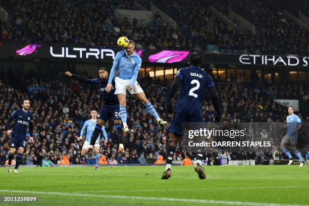 Chelsea's English defender Levi Colwill fights for the ball with Manchester City's Norwegian striker Erling Haaland during the English Premier League...