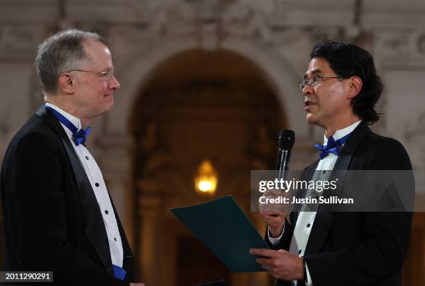 Same-sex couple Stuart Gafney and John Lewis renew their vows during during a "Winter of Love" ceremony at San Francisco City Hall on February 14,...