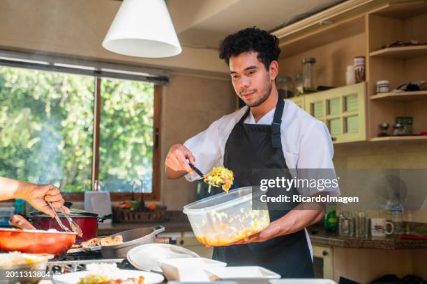 man is serving the nursing home restaurant's buffet lunch - hospital food service stock pictures, royalty-free photos & images