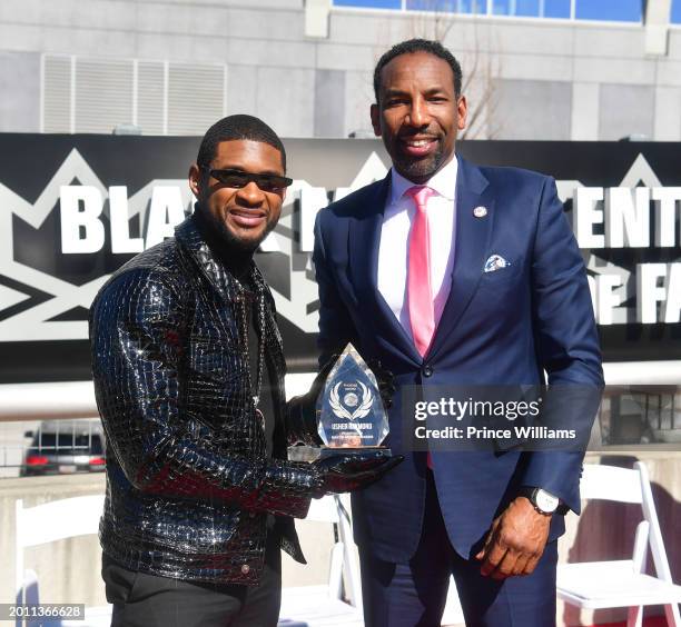Usher and Andre Dickens attend The Black Music And Entertainment Walk Of Fame Honors Usher at Black Music and Entertainment Walk of Fame on February...
