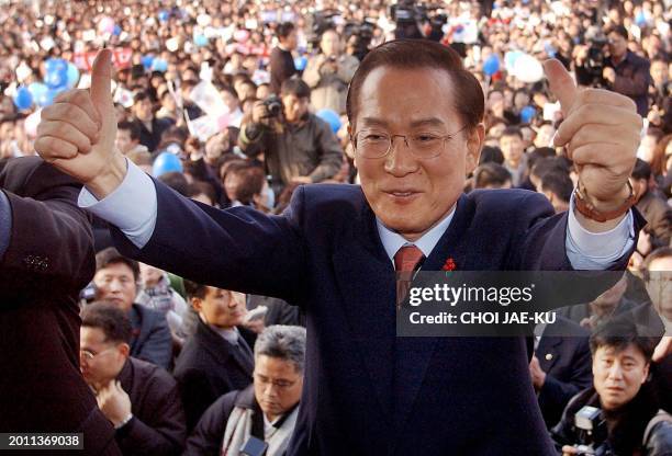 Lee Hoi-Chang, a former prime minister and supreme court justice gives thumbs up during the presidental election campaign in Daejeon, southern Seoul,...