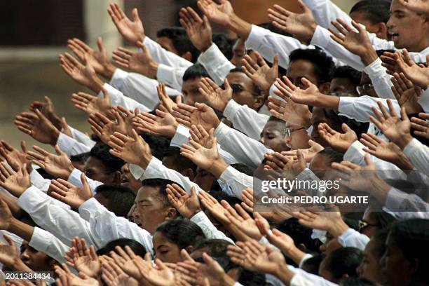 Supporters of Madagascar opposition leader and self-declared president Marc Ravalomanana pray 02 March 2002 in Antananarivo during the public...