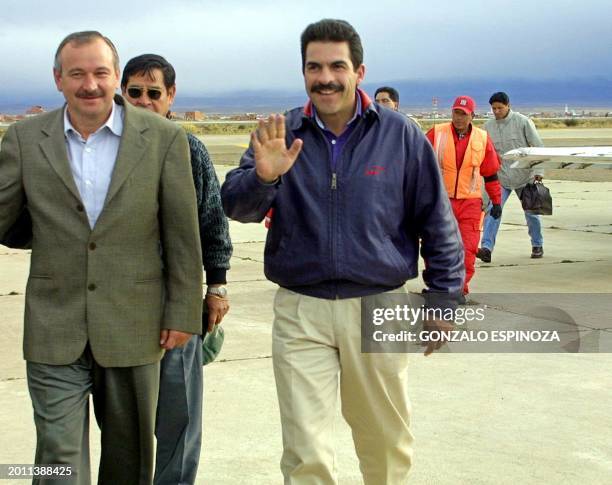 Presidential candidate Manfred Reyes Villa of the Nueva Fuerza Republicana , is accompanied by vice-presidential candidate Ivo Kuljis upon their...