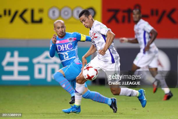Dudu of Ventforet Kofu controls the ball against Yutaka Yoshida of Sagan Tosu during the J.League J1 match between Sagan Tosu and Ventforet Kofu at...