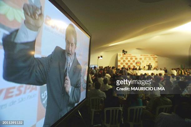 Luis Inacio da Silva "Lula", presidential candidate for Brazil's Labor Party, presents his plan of government at a meeting between candidates in Sao...