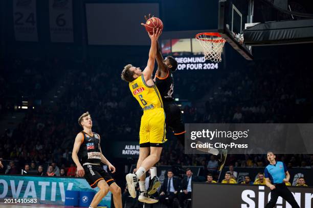 Malte Delow from ALBA Berlin and Joshua Hawley from Ratiopharm Ulm during the semi-final match between ALBA Berlin and Ratiopharm Ulm on in Munich,...