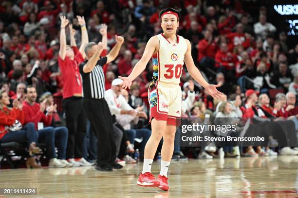 Keisei Tominaga of the Nebraska Cornhuskers celebrates after making a three point basket against the Penn State Nittany Lions in the second half at...