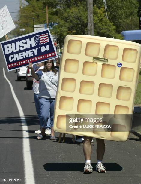 Supporters of US President George W. Bush, including one in a waffle costume, demonstrates 10 September 2004 in St Louis, Missouri across the street...