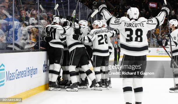 Brandt Clarke of the Los Angeles Kings celebrates with his teammates after he scored in overtime against the Boston Bruins at the TD Garden on...