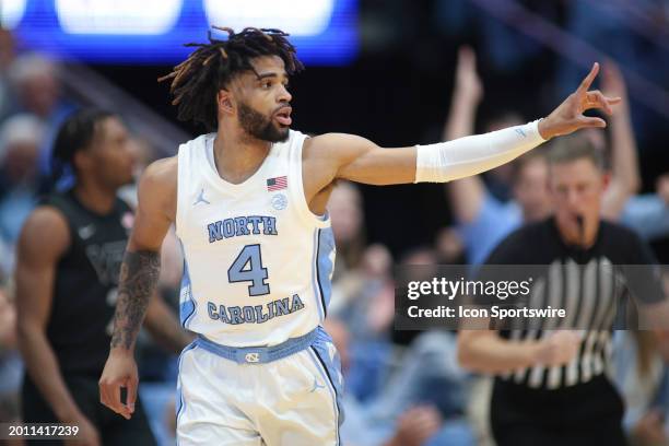 North Carolina Tar Heels guard RJ Davis signals after a three point basket during the college basketball game between the North Carolina Tar Heels...