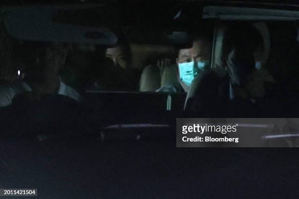 Thaksin Shinawatra, Thailand's former prime minister, right back seat, leaves in a vehicle from Police General Hospital with his daughter Paetongtarn...