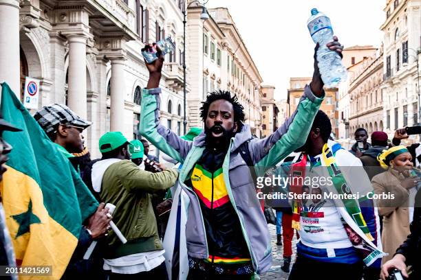 People take part in a demonstration by the Senegalese Community In Italy against President of Senegal Macky Sall on February 17, 2024 in Rome, Italy....