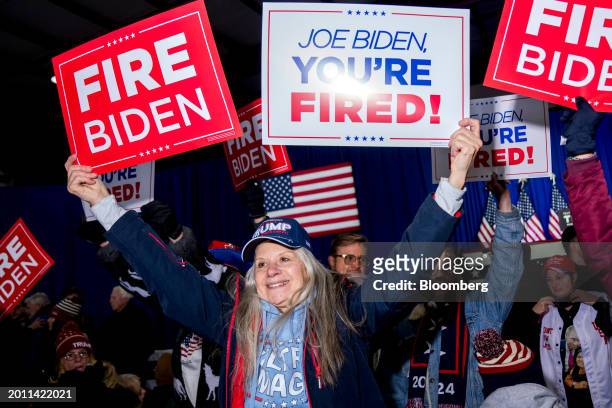 An attendee holds a sign against US President Joe Biden ahead of a "Get Out The Vote" rally with former US President Donald Trump, not pictured, in...
