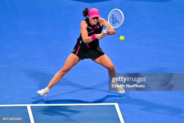 Iga Swiatek of Poland is playing her final match against Elena Rybakina of Kazakhstan at the WTA 1000-Qatar TotalEnergies Open tennis tournament at...