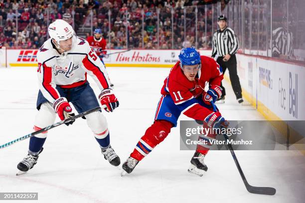 Brendan Gallagher of the Montreal Canadiens skates with the puck under pressure from Trevor van Riemsdyk of the Washington Capitals during the first...