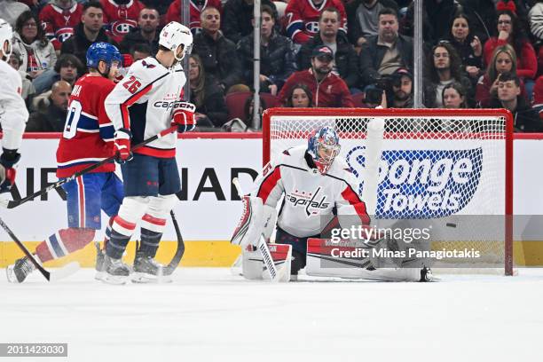 Goaltender Darcy Kuemper of the Washington Capitals gets low as the puck enters his net during the first period against the Montreal Canadiens at the...