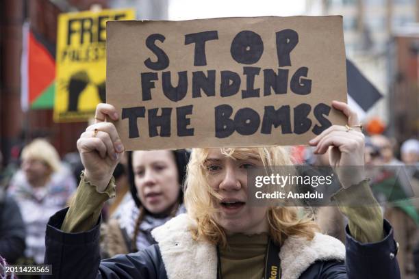 Protestor holds a sign written 'Stop Funding the Bombs' during the Global March for Rafah in Washington DC to demand an immediate ceasefire and an...