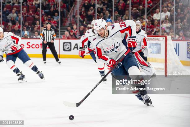 Nic Dowd of the Washington Capitals skates with the puck during the second period of the NHL regular season game between the Montreal Canadiens and...