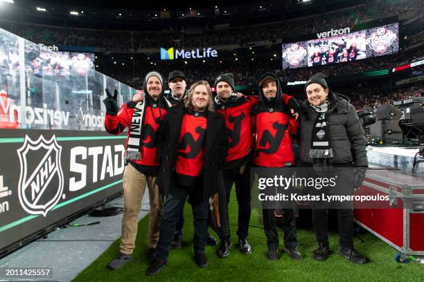 The Gaslight Anthem pose for a photo after their performance during the game between the Philadelphia Flyers and the New Jersey Devils at MetLife...